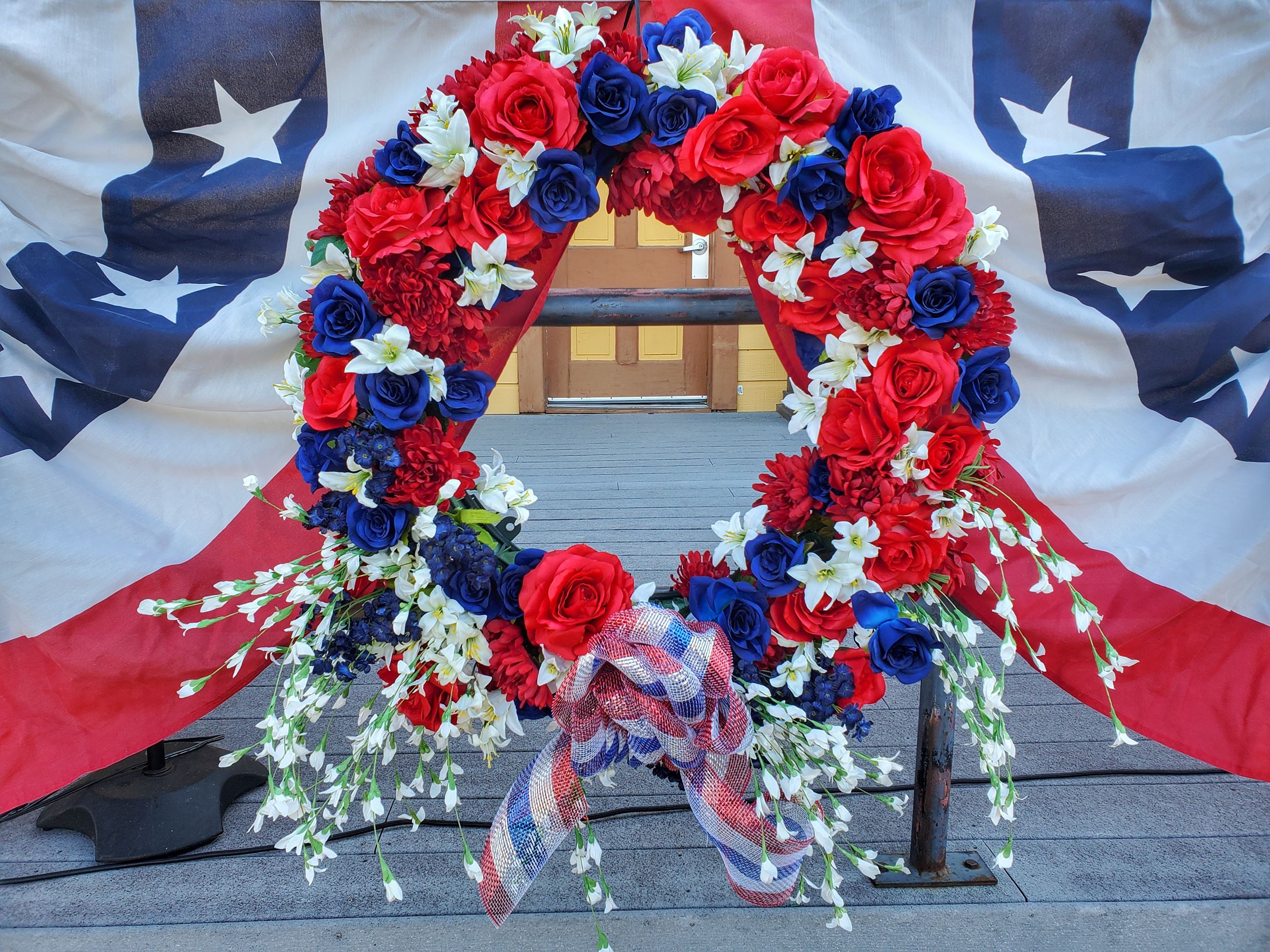 Image of a red, white, and blue wreath