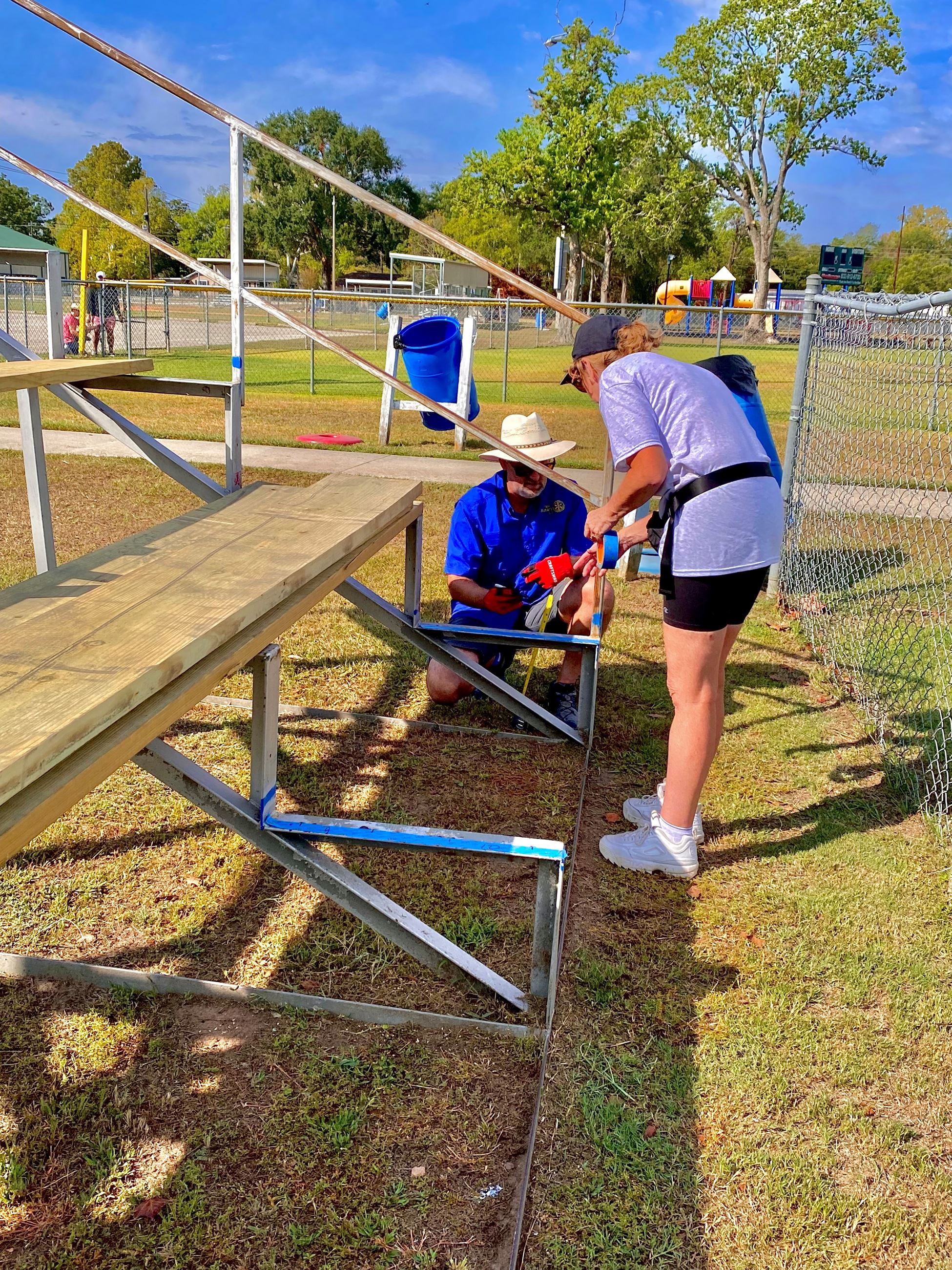 picture of a two-person crew marking the area