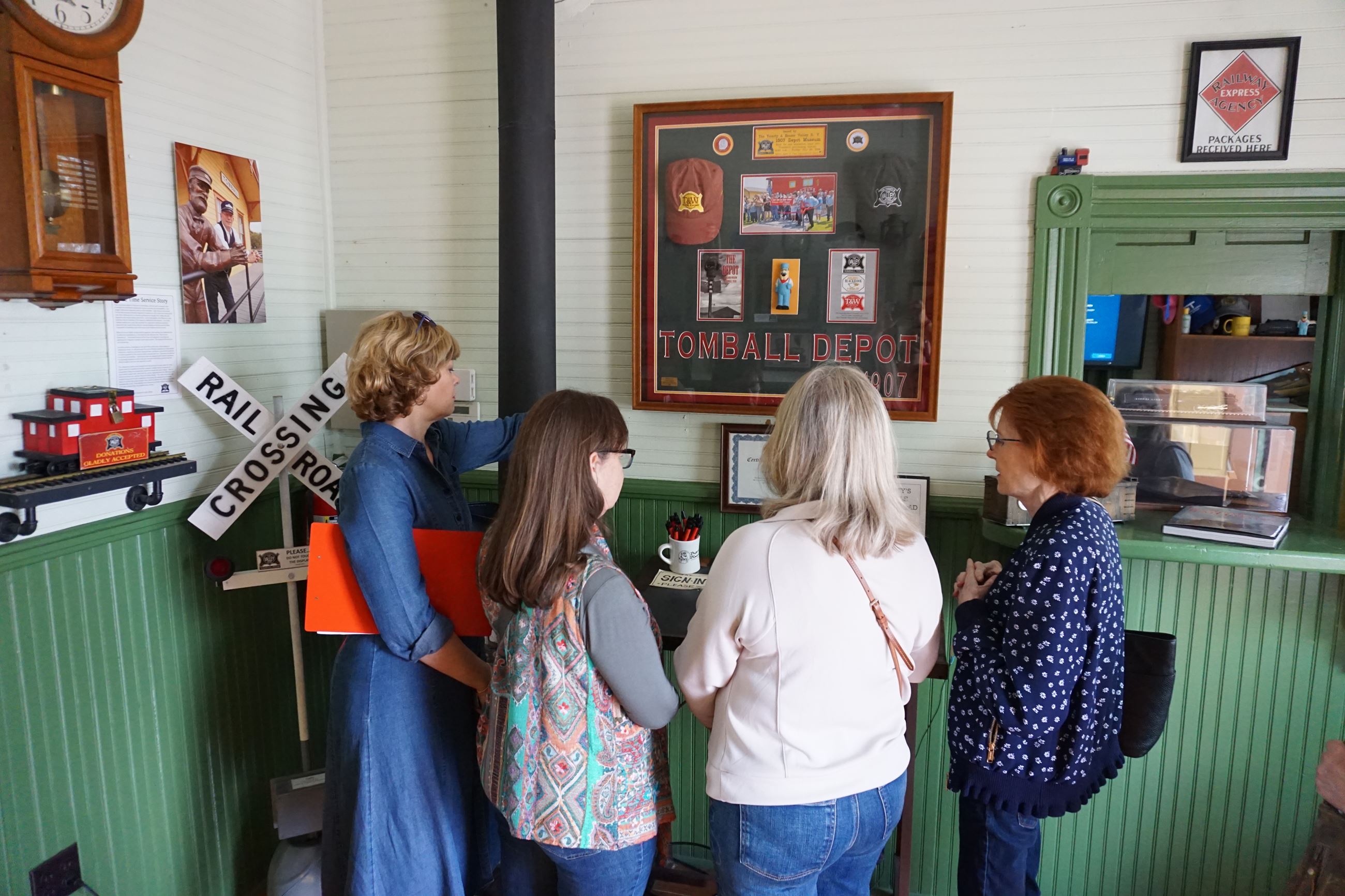 Group of ladies discover more as they read through historic memorabilia