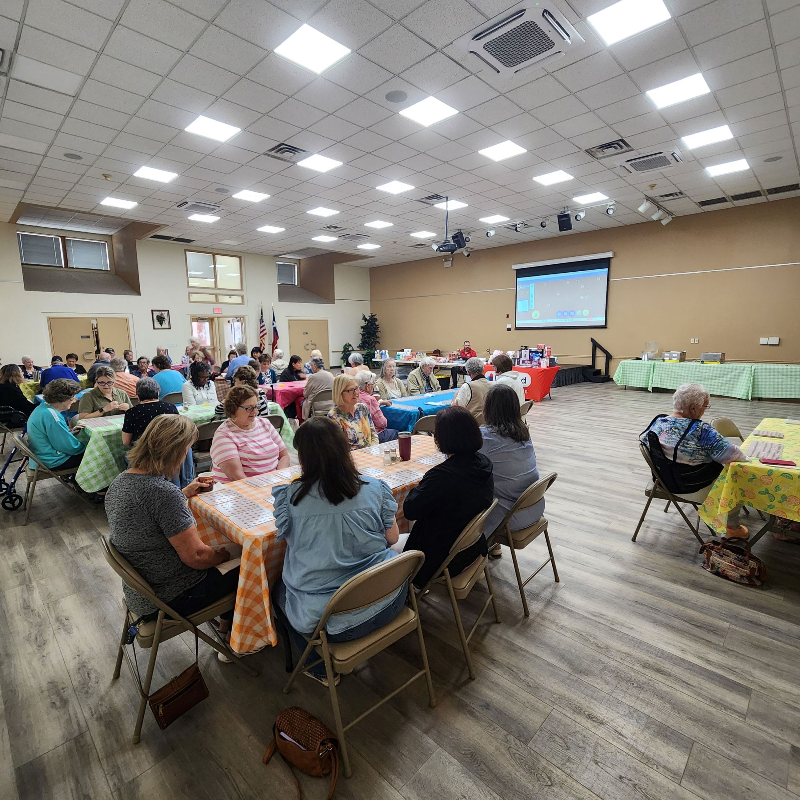 picture of participants playing bingo and eating breakfast