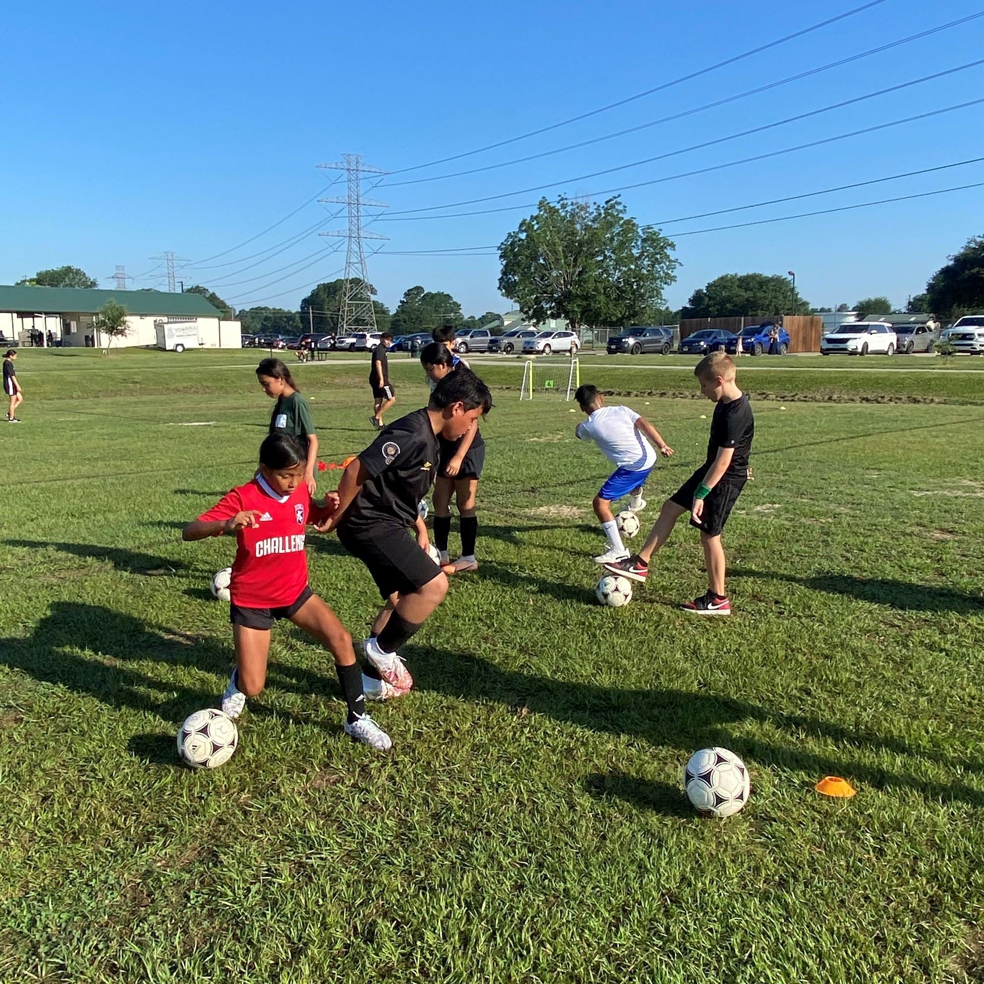 picture of campers practicing foot dribbling
