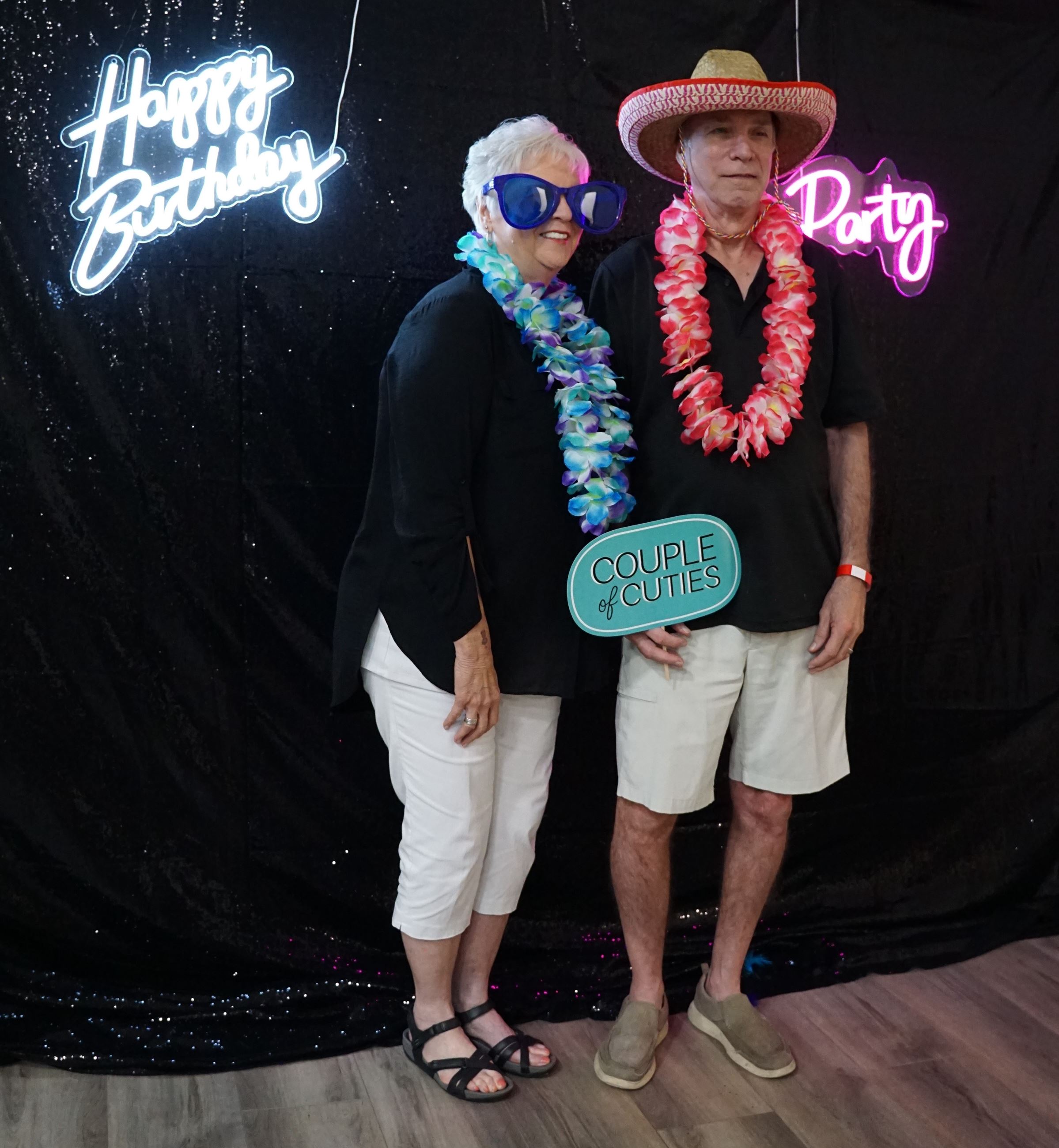 picture of two members donning props for a picture at the photo booth