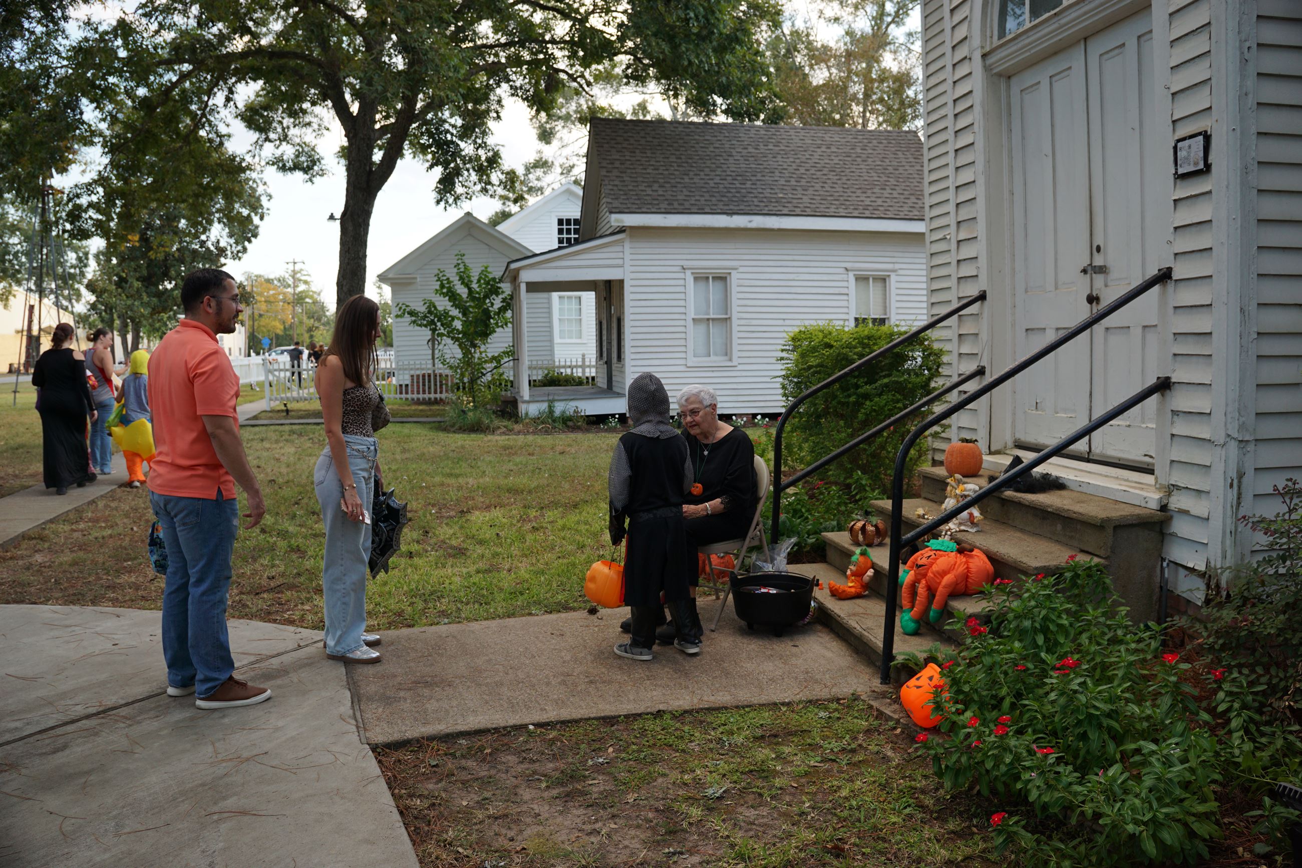 Image of Volunteers handing out candy at Tomball Museum Center Halloween at the Museum 2024