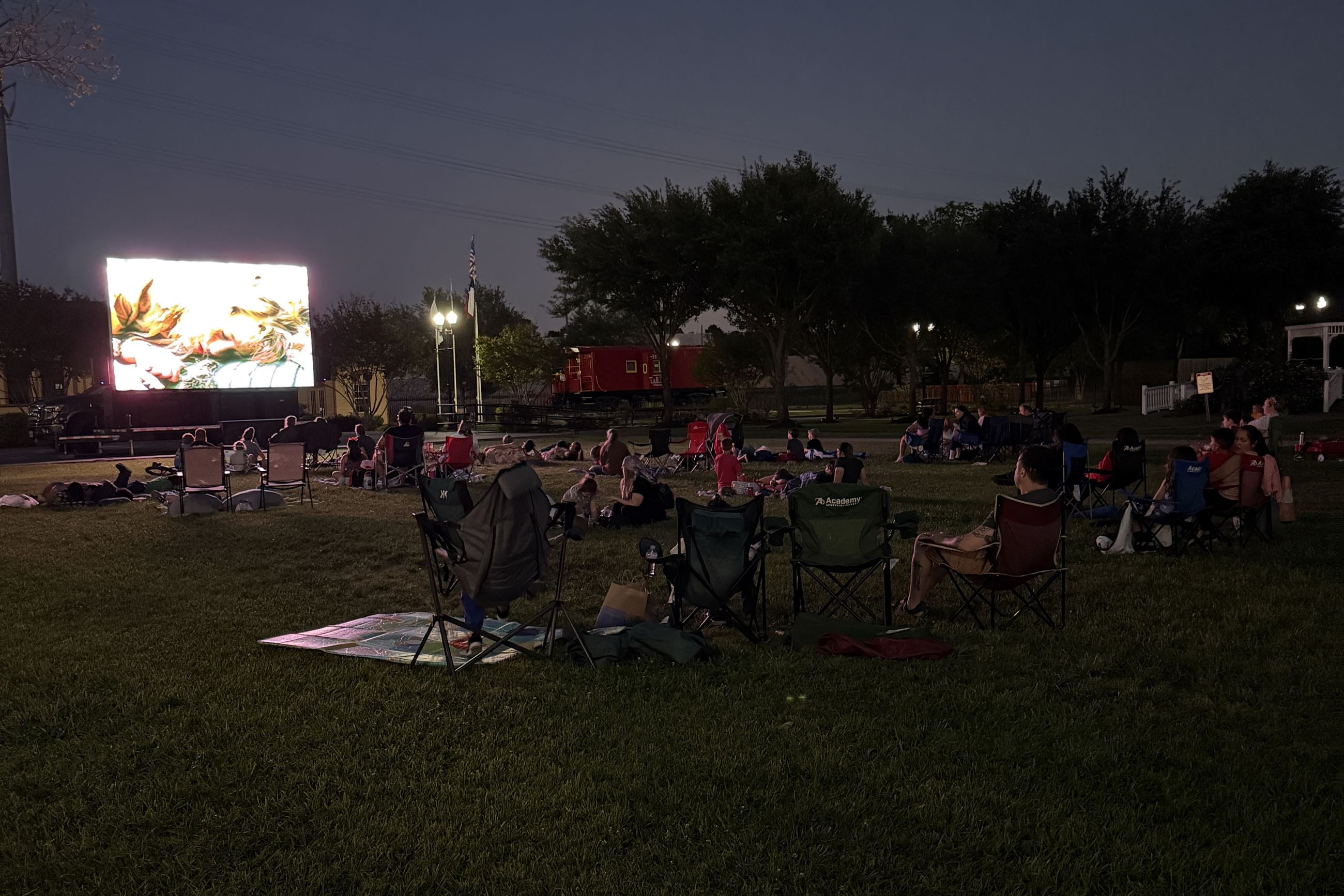 Image of moviegoers at April 2025 2nd Saturday at the Depot watching Honey, I Shrunk The Kids