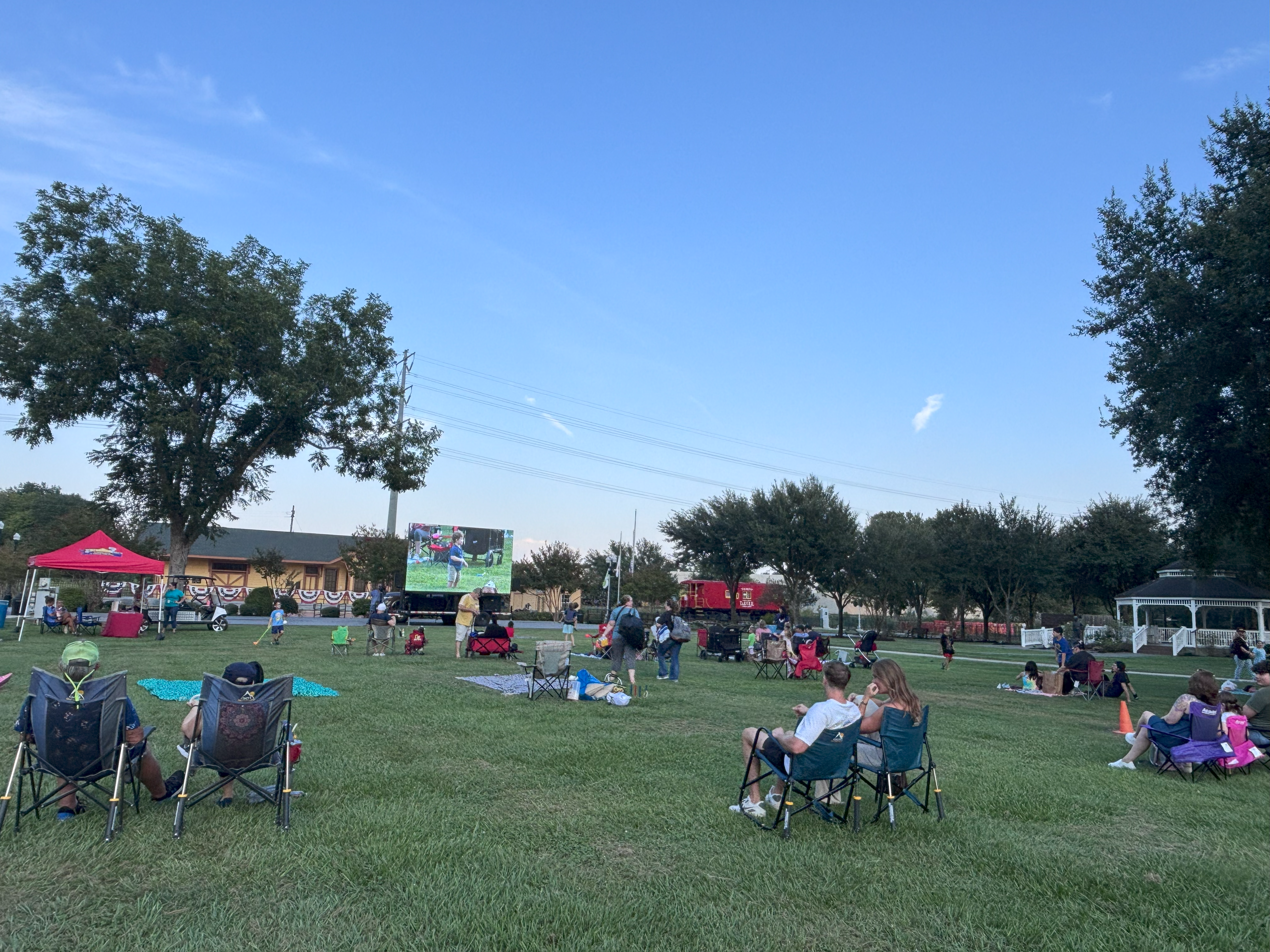 Image of the Second Saturday Attendees watching the big screen for September 2025 movie night