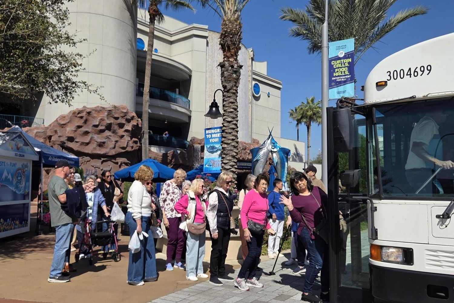 Image of guests boarding bus for Tomball Community Center's February 2026 Aquarium Bus Trip